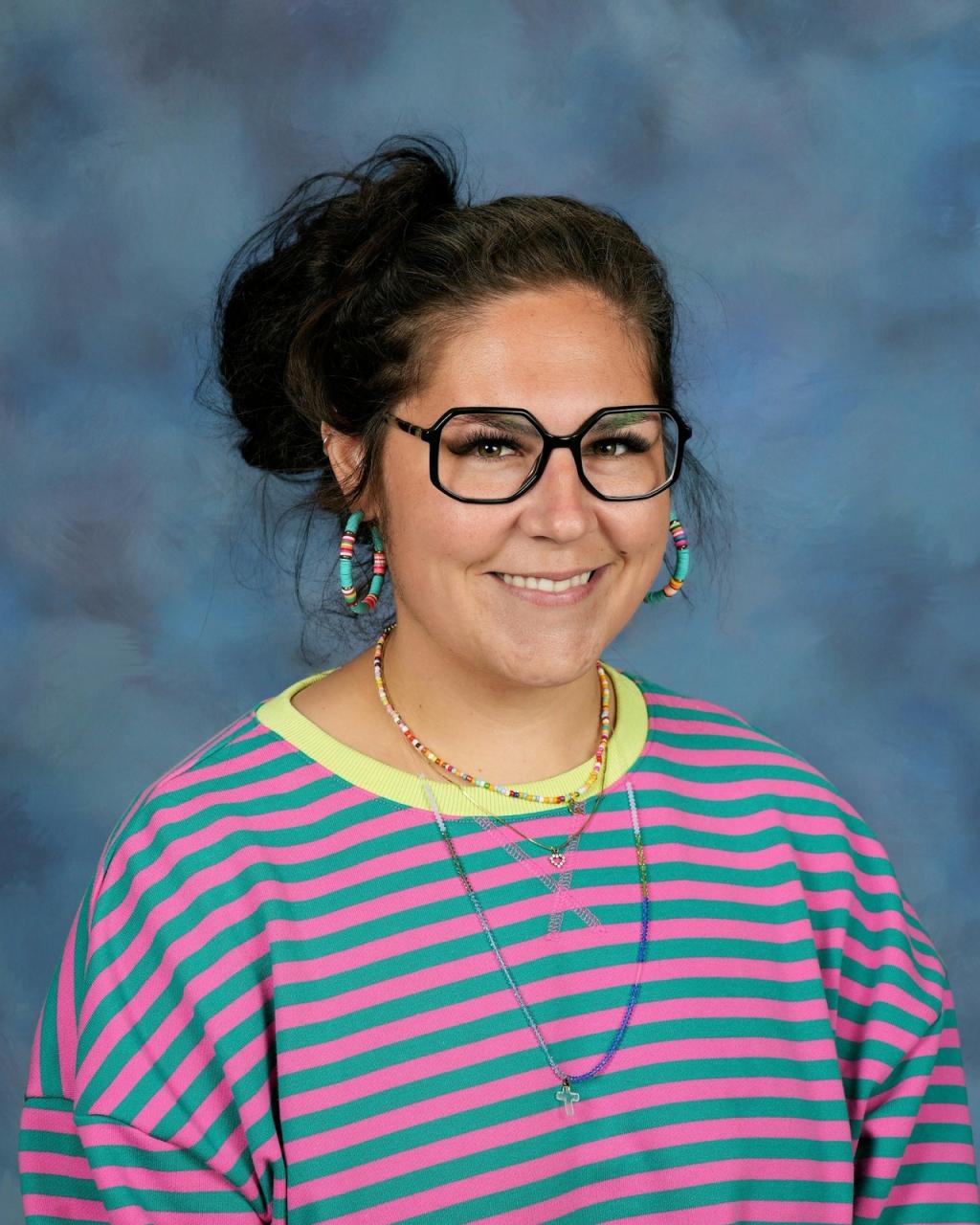 Woman wearing glasses and striped shirt